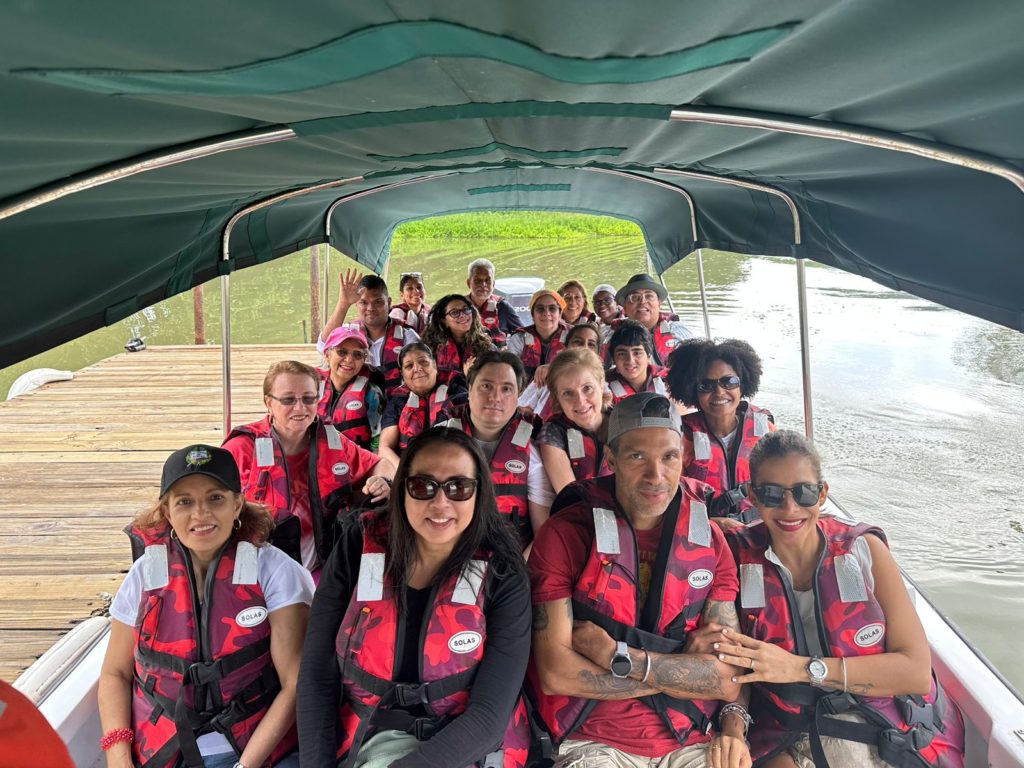 Group of translators on a green-roofed boat