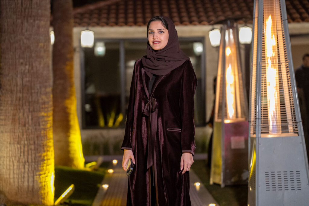 a photo of a woman in brown clothing